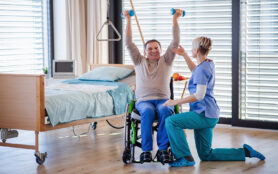 A Healthcare Worker And Senior Patient In Hospital, Physiotherapy.