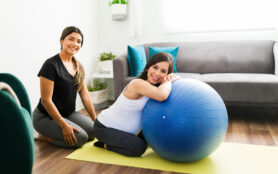 Portrait,Of,A,Happy,Caucasian,Woman,And,Her,Midwife,Smiling