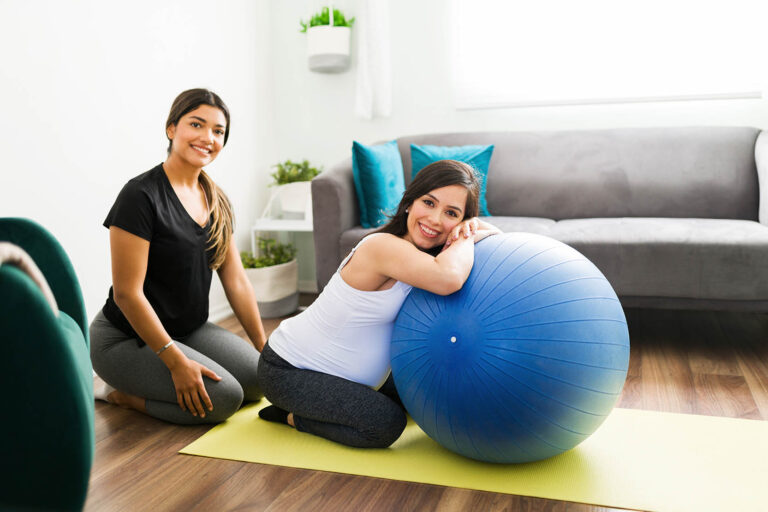 Portrait,Of,A,Happy,Caucasian,Woman,And,Her,Midwife,Smiling