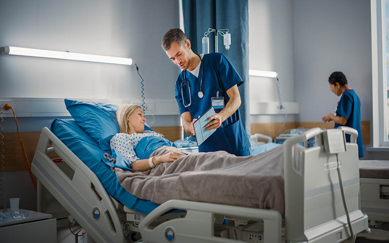 Hospital,Ward:,Friendly,Male,Nurse,Talks,To,Beautiful,Female,Patient