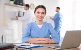 Portrait,Of,Female,Doctor,At,Table,In,Modern,Clinic