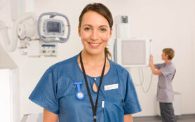 A,Medium,Shot,Of,A,Young,Adult,Radiologist,Smiling,At