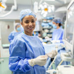 Anesthesiologist,Checking,Monitors,While,Sedating,Patient,Before,Surgical,Procedure,In