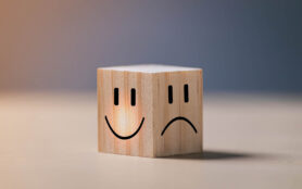 Smile,Face,On,Bright,Side,And,Sad,Face,On,Dark
