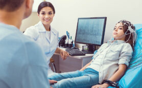 Stressed,Moment.,Smiling,Female,Doctor,Smiling,To,A,Father,While