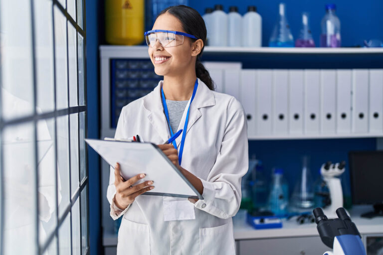 Young,African,American,Woman,Scientist,Write,On,Report,Document,At