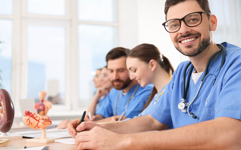 Portrait,Of,Mature,Intern,Wearing,Uniform,On,Lecture,In,University
