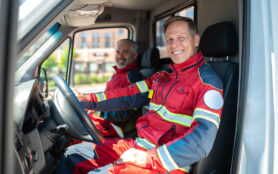 Paramedics,Posing,For,The,Camera,In,The,Medical,Emergency,Vehicle