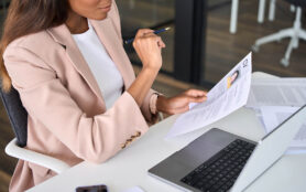 Close,Up,View,Of,Female,Hr,Manager,Reading,Cv,During