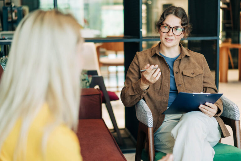 A,Female,Psychologist,Advises,A,Client.,Portrait,Of,A,Professional