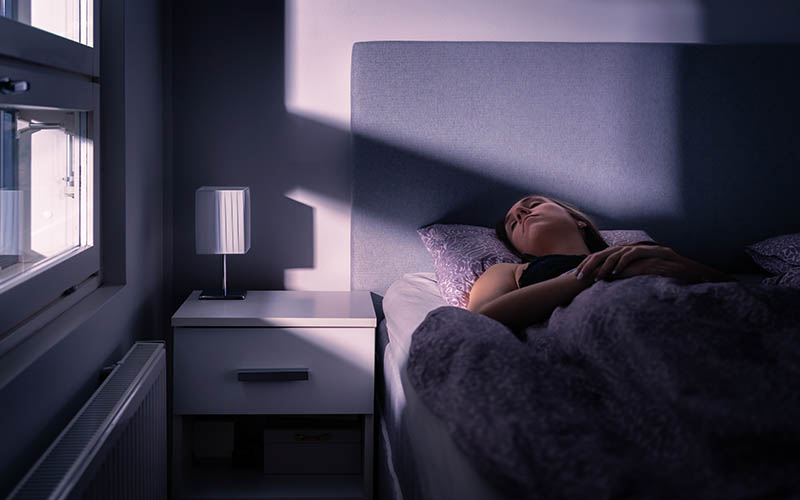 Sleeping,Woman,In,Bed,At,Night,In,Dark,Bedroom.,Person